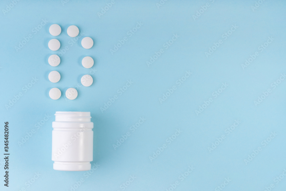 Vitamin D pills dropped from bottle on blue. Letter D inscription from tablets. Vitamin D concept. Immunity protection concept, antiviral prevention. Nutritional supplements. Top view, copy space Vitamin D pills dropped from bottle on blue. Letter D inscription from tablets. Vitamin D concept. Immunity protection concept, antiviral prevention. Nutritional supplements. Top view, copy space