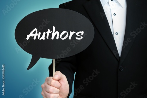 Authors. Lawyer in suit holds speech bubble at camera. The term Authors is in the sign. Symbol for law, justice, judgement