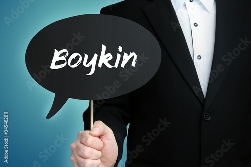 Boykin. Lawyer in suit holds speech bubble at camera. The term Boykin is in the sign. Symbol for law, justice, judgement photo