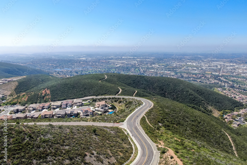 Aerial view of upper middle class neighborhood with big villas around Double Peak Park in San Marcos, California, USA.