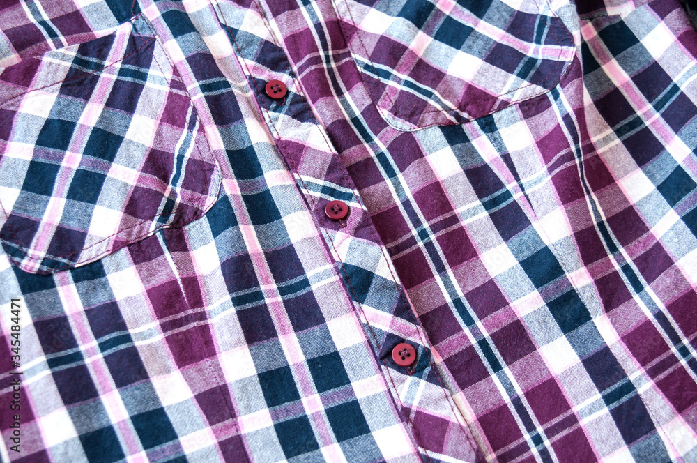 Background of plaid shirts, pockets, and clasp