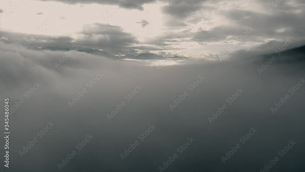 Breathtaking View On Top Of The Thick Gray Clouds In Alberta, Canada On A Cloudy Day - Aerial Shot Breathtaking View On Top Of The Thick Gray Clouds In Alberta, Canada On A Cloudy Day - Aerial Shot