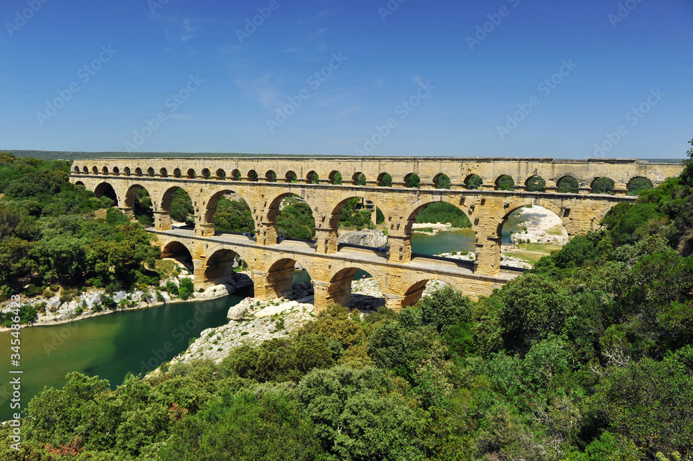ancient Roman aqueduct In FRANCE with river beneath it