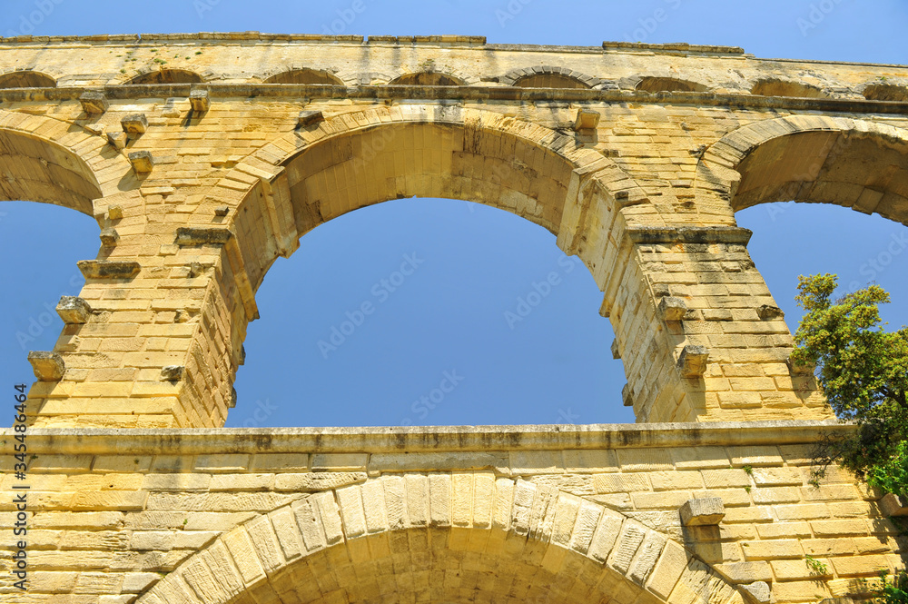 ancient Roman aqueduct In FRANCE with river beneath it