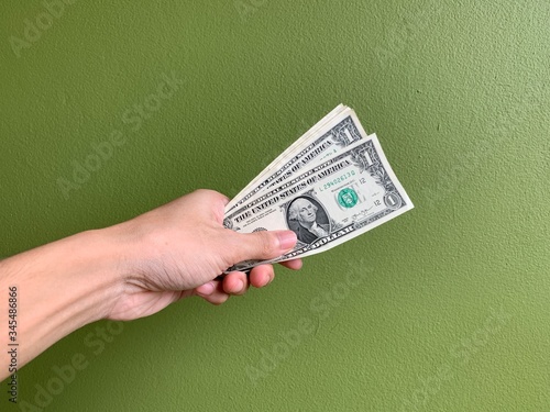 Hand with money, giving money