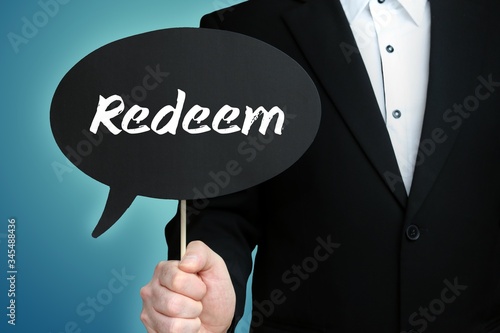 Redeem. Lawyer in suit holds speech bubble at camera. The term Redeem is in the sign. Symbol for law, justice, judgement
