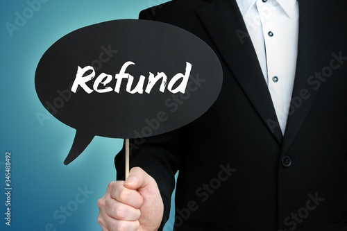 Refund. Lawyer in suit holds speech bubble at camera. The term Refund is in the sign. Symbol for law, justice, judgement