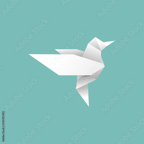 origami paper bird will fly to freedom on blue background.