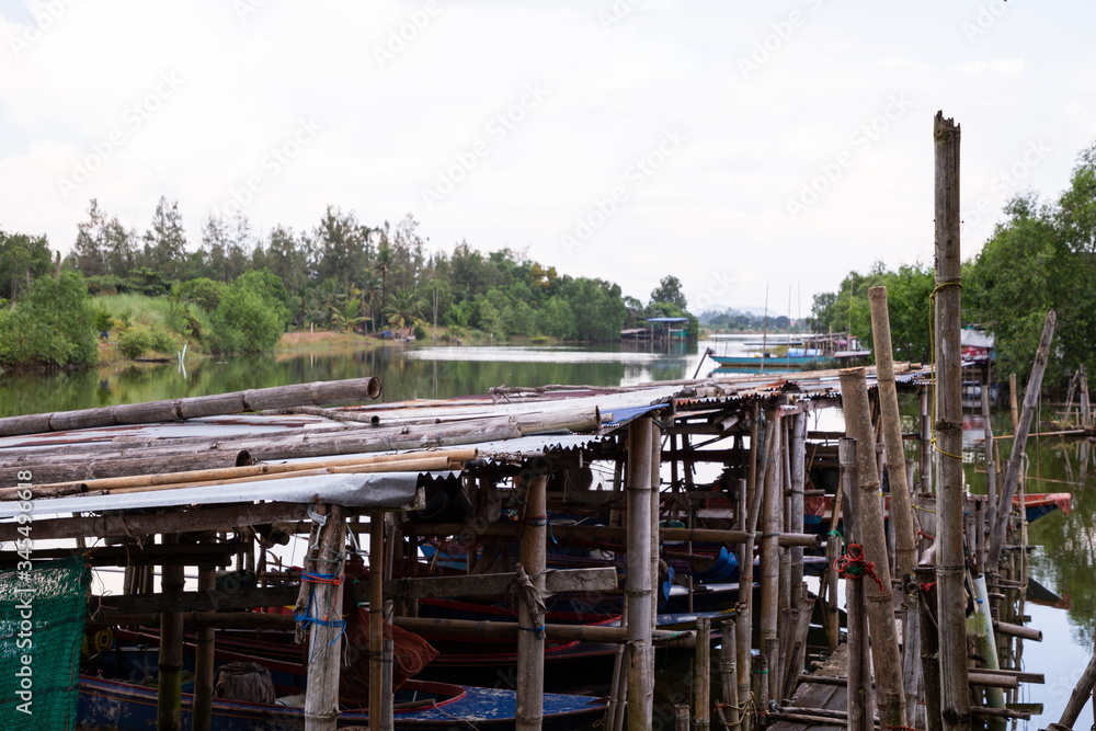 fisherman boat bamboo port on river at countryside . fisherman boat bamboo port on river at countryside .