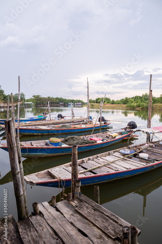 fisherman boat on river at countryside wooden port .