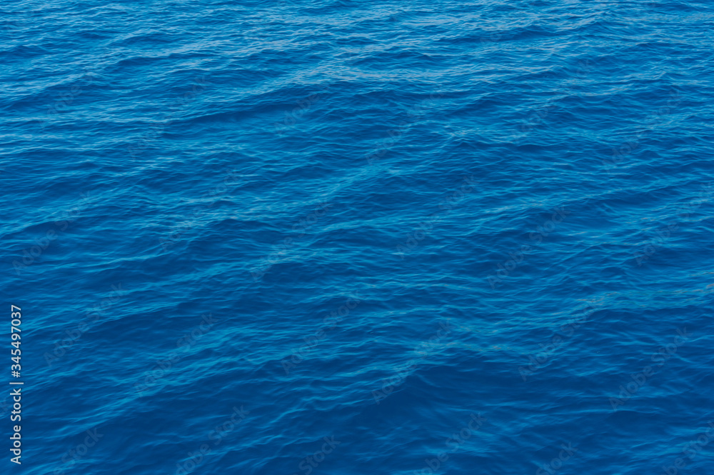 A close up of the deep and pristine blue Mediterranean sea on a sunny day, in Sardinia Italy A close up of the deep and pristine blue Mediterranean sea on a sunny day, in Sardinia Italy