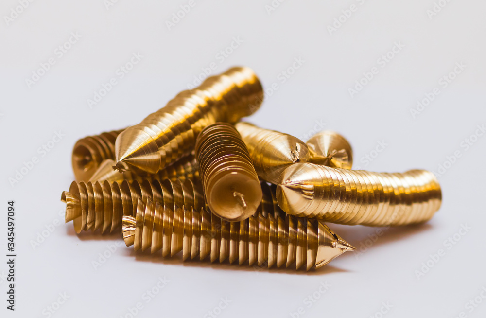Brass shavings on white background Brass shavings on white background