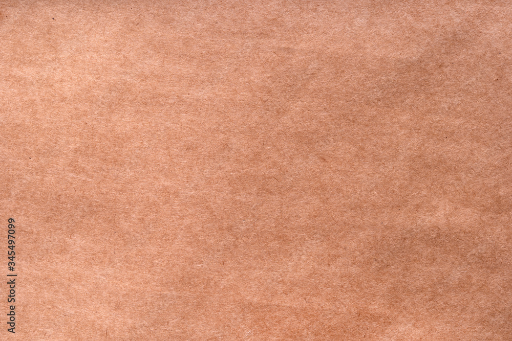Fototapeta premium Textured craft surface. Brown paper sheet texture background or cardboard surface