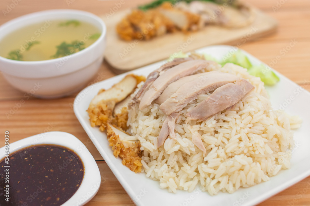 Chicken rice on the table, brown wood background. Chicken rice on the table, brown wood background.
