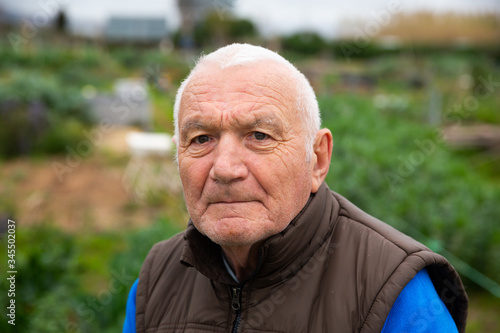 Photos Close up face of elderly gardener