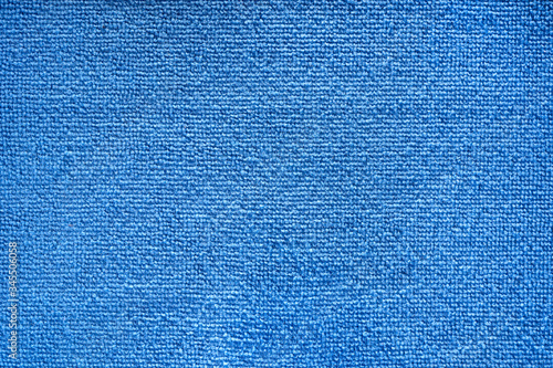 Microfiber towel blue terry texture swatch. Fabric texture background. Cleaning service. Macro object.