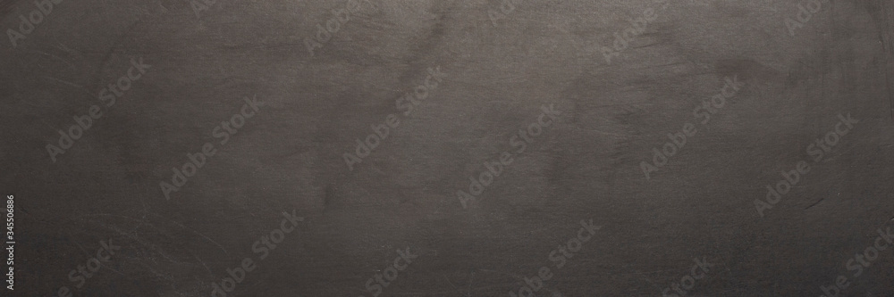 Black chalk board. Can be used as texture or wallpaper. Banner. Flat lay, top view Black chalk board. Can be used as texture or wallpaper. Banner. Flat lay, top view