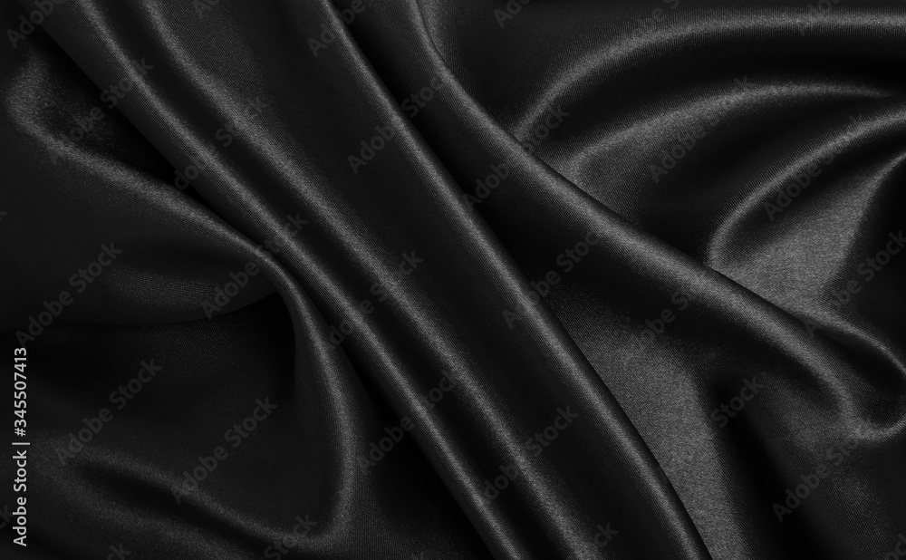 Smooth elegant black silk or satin texture as abstract background