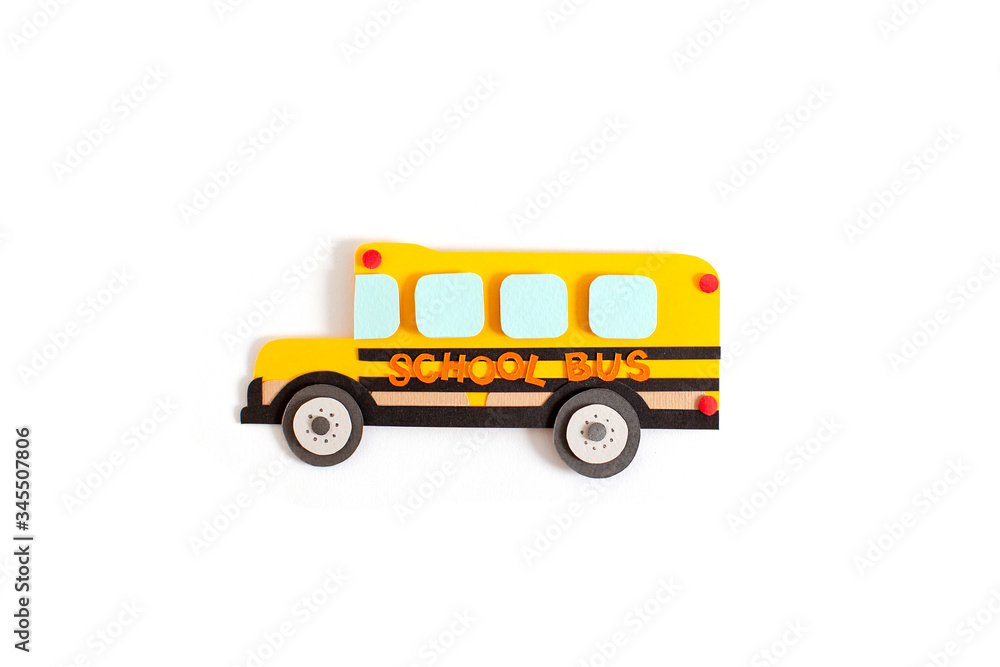 Paper cutting school bus on isolated background. Handmade. 