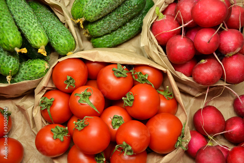 Fresh vegetables from farmers market. Cucumbers  tomatoes  radish. Pickle cucumbers. Organic vegetables. Salad ingredients.