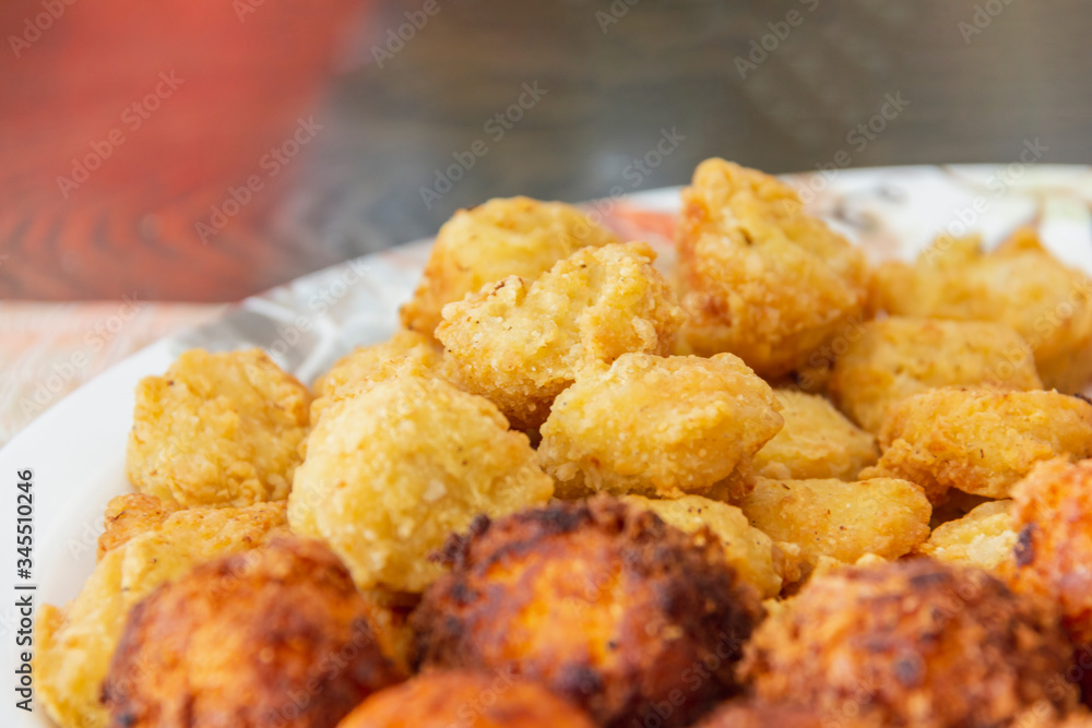 delicious chicken nugget fried with cheese ball on white disc ready eat delicious chicken nugget fried with cheese ball on white disc ready eat