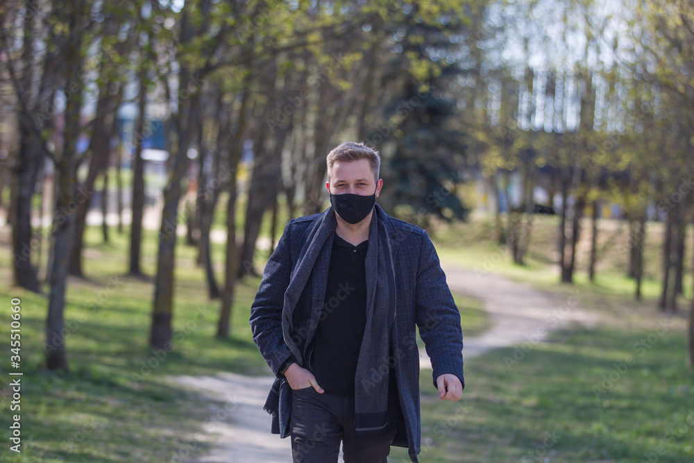 Masked a man walking in the park