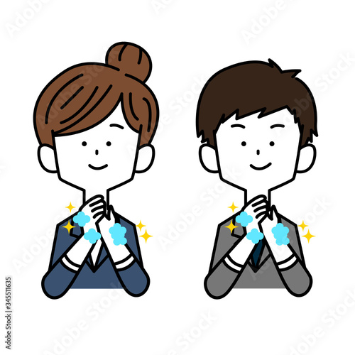手洗いをするスーツを着た男女