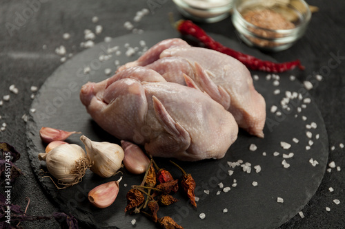Fototapeta Raw partridge meat on kitchen, cooking gourmet wild bird