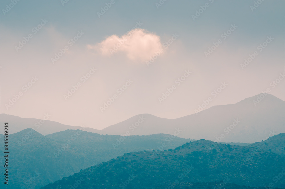 White cloud in the sky over the mountains. Beautiful nature background. Crete island, Greece