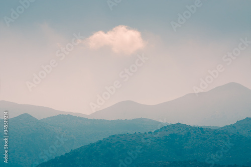 White cloud in the sky over the mountains. Beautiful nature background. Crete island, Greece