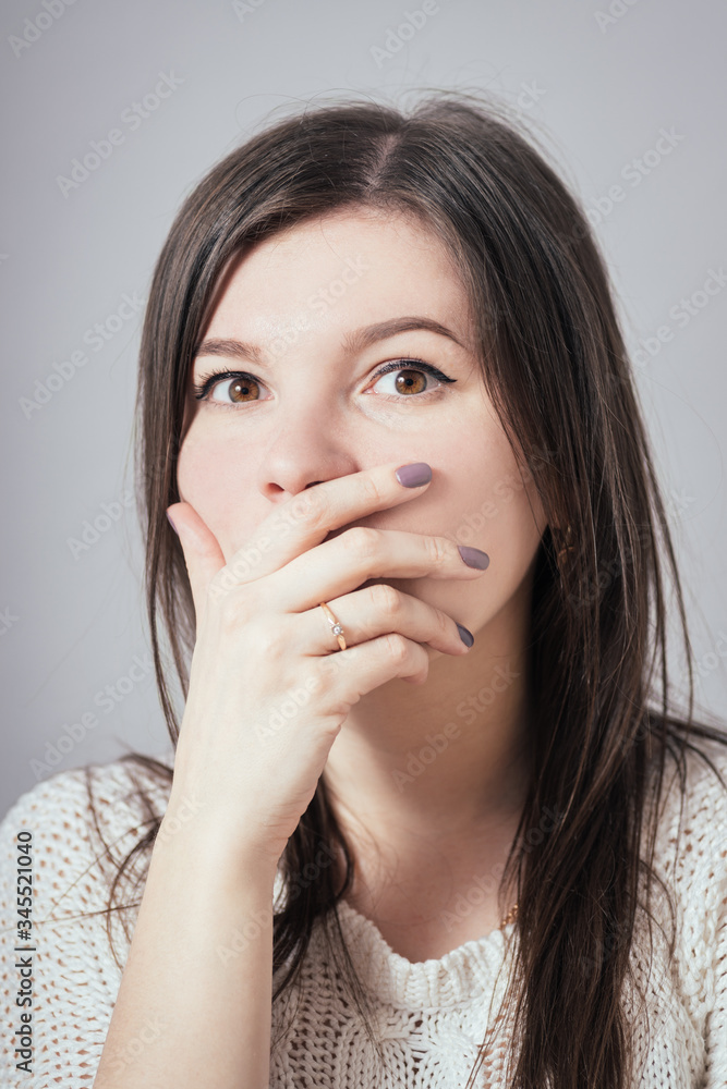 woman surprised and covered her mouth with his hand woman surprised and covered her mouth with his hand