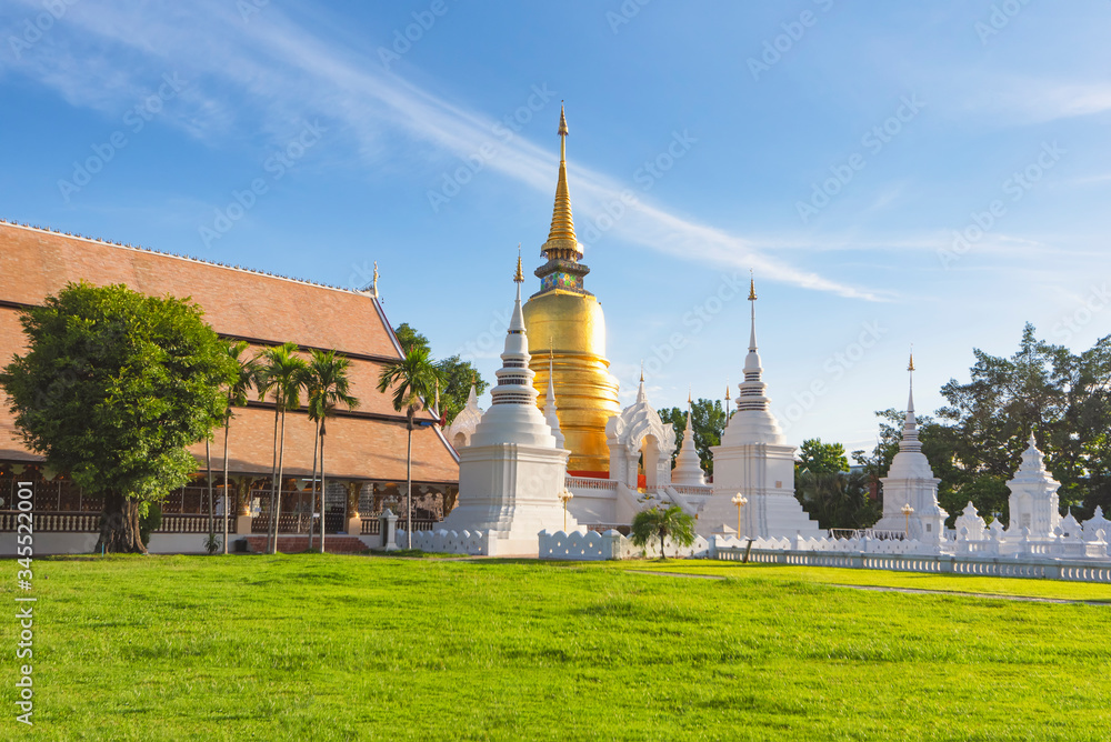Great Golden Pagoda surrounding smaller white pagodas at Wat Suan Dok Temple, Chiangmai, Thailand