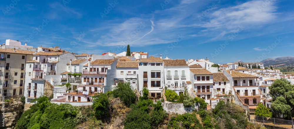 Panorama of white houses on the cliffs of historic city Ronda, Spain
