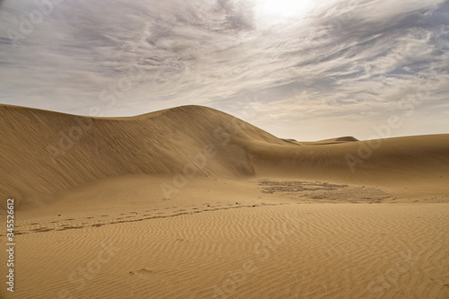 summer desert landscape on a warm sunny day from Maspalomas dunes on the Spanish island of Gran Canaria