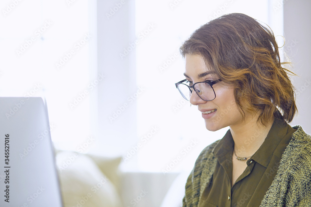 Young woman working with graphic tablet in office Young woman working with graphic tablet in office