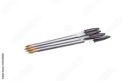  black plastic pens on a white isolated background
