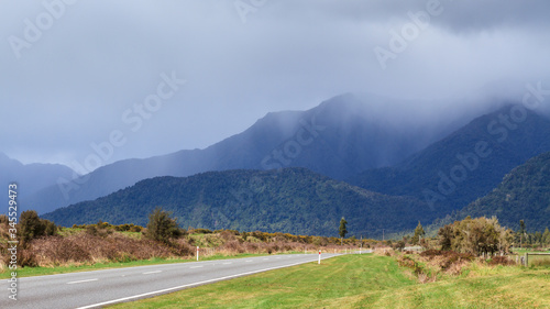 Landscape on the West Coast of New Zealand's South Island. Storm clouds are moving in over the Southern Alps © Michael