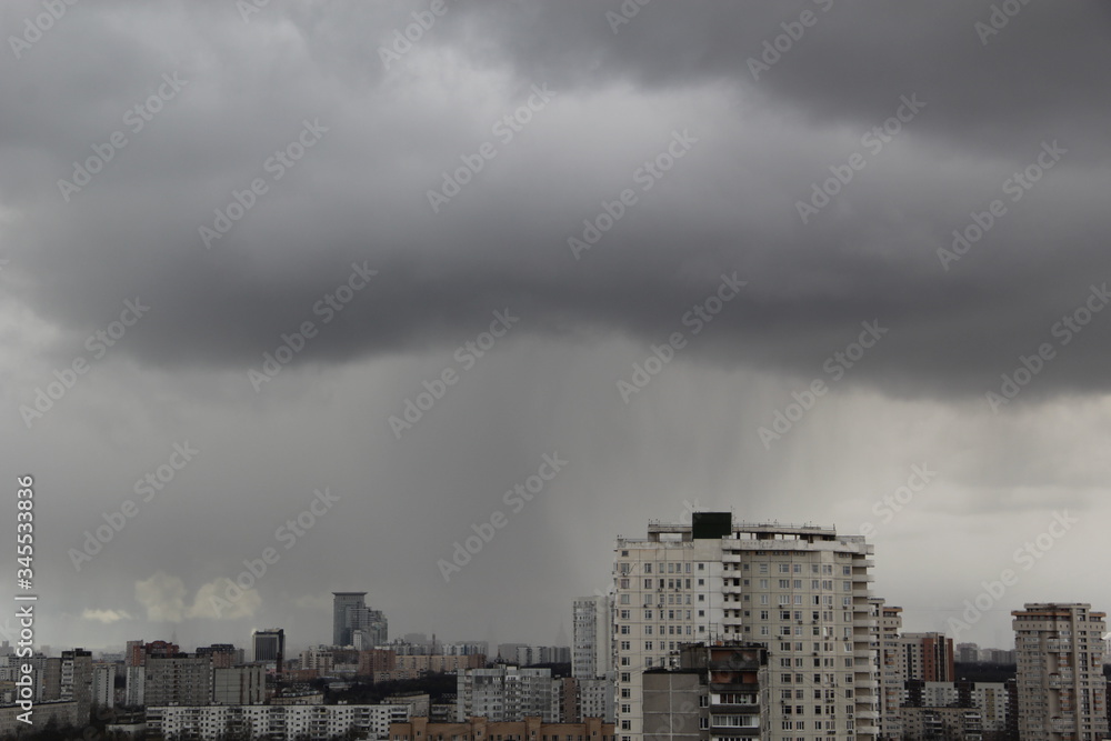 Dark overcast sky over the city during the day