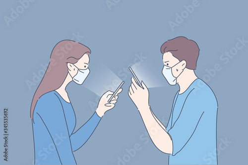 Protection, quarantine, communication, infection, coronavirus concept. Couple man and woman with medical face masks sit home communicate online reading news. 2019ncov biohazard COVID19 desease danger.