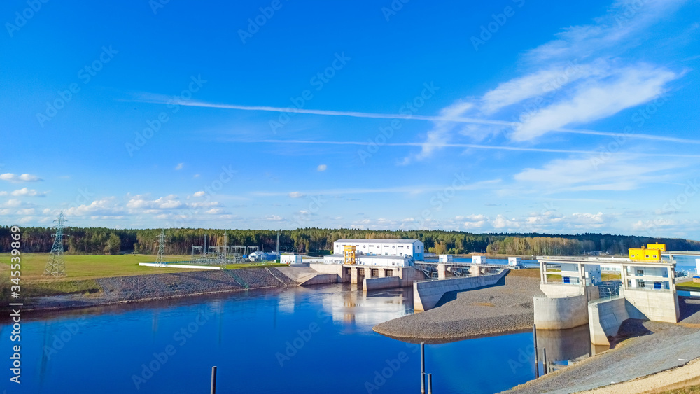 View on hydroelectric power station in Belarus, Vitebsk. Dam on a small river with beautiful views of nature.