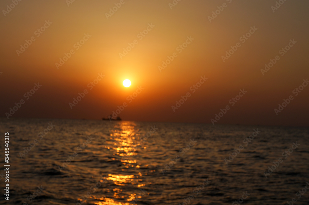beautiful sunrise and ship on sea 
