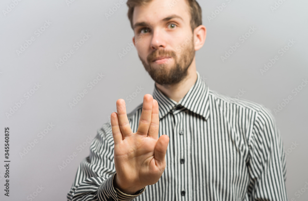 a man hand doing the Vulcan salute a man hand doing the Vulcan salute