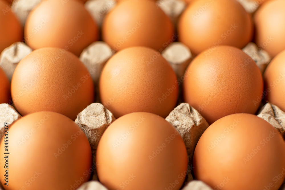 Brown egg in paper packaging. Container for eggs. Recycling. Healthy rustic breakfast Brown egg in paper packaging. Container for eggs. Recycling. Healthy rustic breakfast