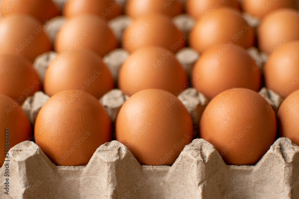 Brown egg in paper packaging. Container for eggs. Recycling. Healthy rustic breakfast Brown egg in paper packaging. Container for eggs. Recycling. Healthy rustic breakfast