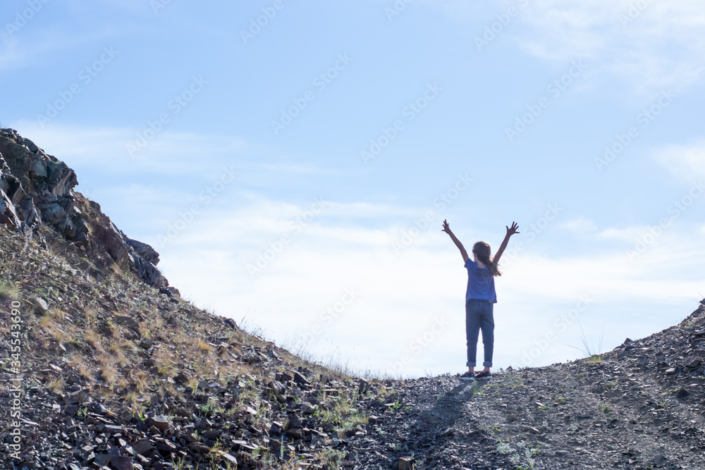 Child girl on the top of the mountain Child girl on the top of the mountain