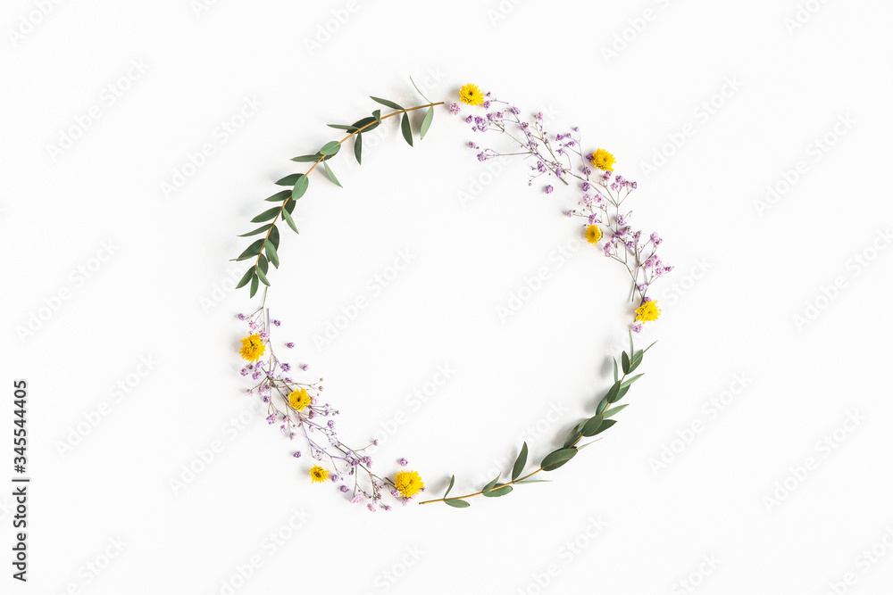 Fototapeta premium Flowers composition. Wreath colorful flowers, eucalyptus leaves on white background. Spring concept. Flat lay, top view, copy space