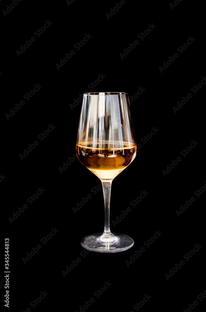 Glass of white wine on black background Glass of white wine on black background