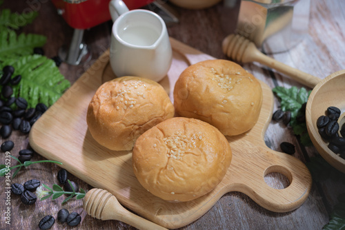 Tasty buttery buns on  wooden table
