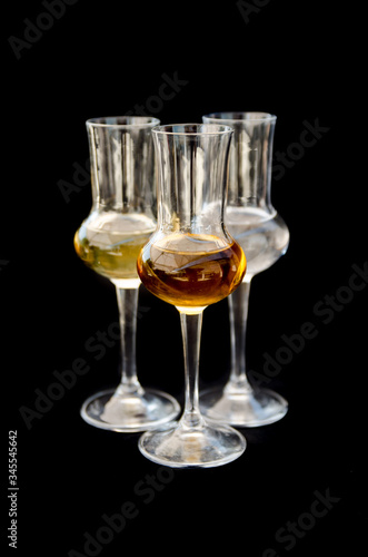 Three glasses of spirits vodka cognac and brandy
