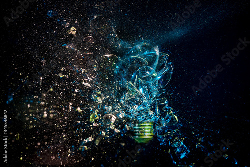 Fototapeta Naklejka Na Ścianę i Meble -  explosion of a glass bulb on black. High speed photography.